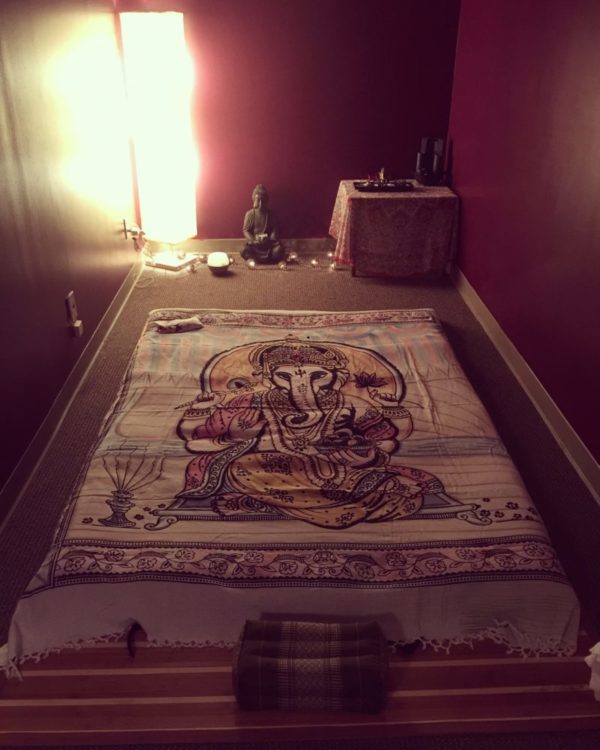 Photo of Erica Sparks Massage space set up for massage styles that use a Thai yoga mat